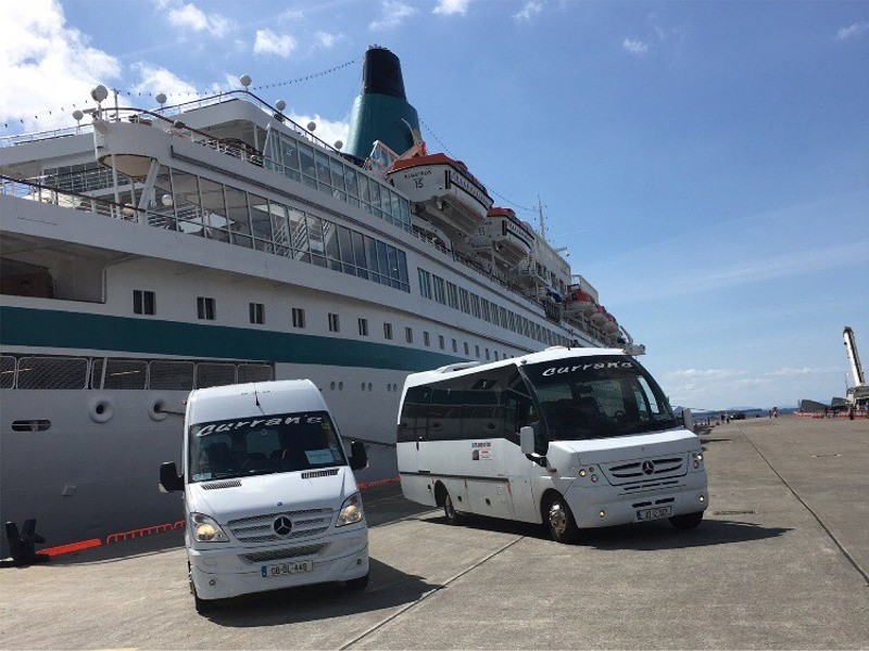 MS Albatross Cruise ship in Killybegs Harbour greeted by Curran Coaches Tour Buses, County Donegal, Ireland