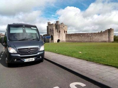 Curran Coaches minibus at Trim Castle - Donegal Coach Hire, Ireland